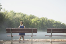 woman sitting on a park bench