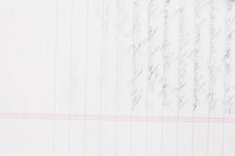Notebook paper with writing on the back.