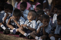 Children praying in central India