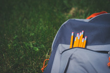 pencils in a book bag 