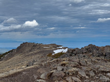 Looking across the summit with clouds in the background.