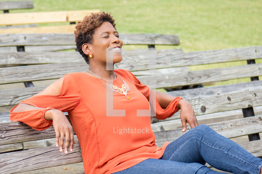 a woman relaxing at a park 