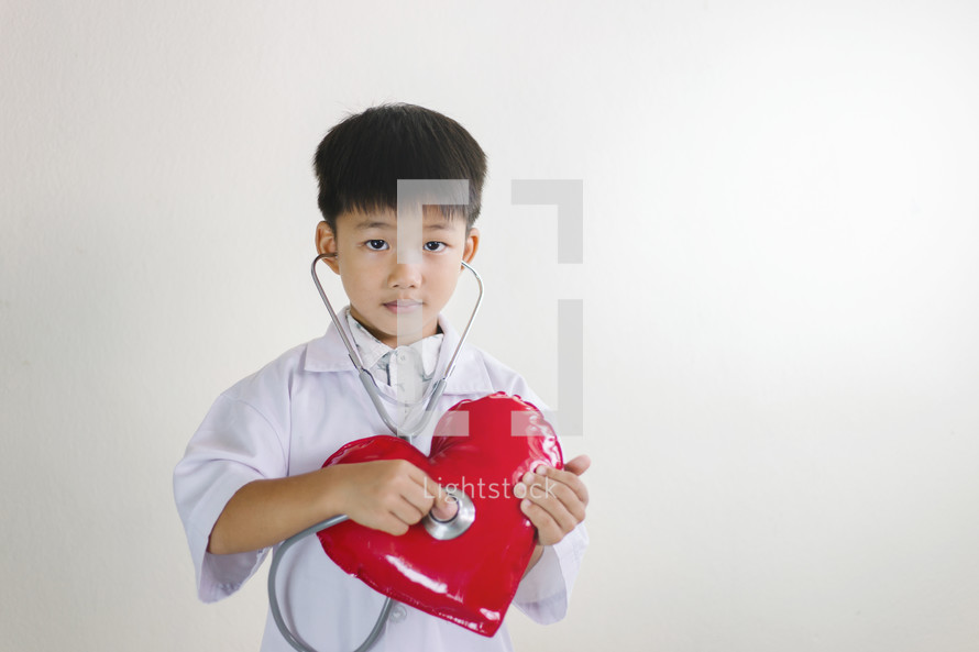 boy with stethoscope and heart 