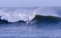 surfer catching big waves 