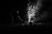 man lighting fireworks