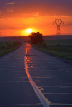 Road to the sunset in spring time
