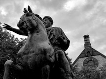 statue of a man on a horse 