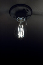 glowing filaments in an Edison bulb 