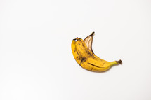 spoiled banana peel on an isolated white background with copy space