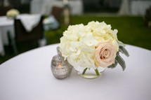 flowers in a vase as a centerpiece on a table 