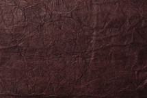 maroon textured paper background.