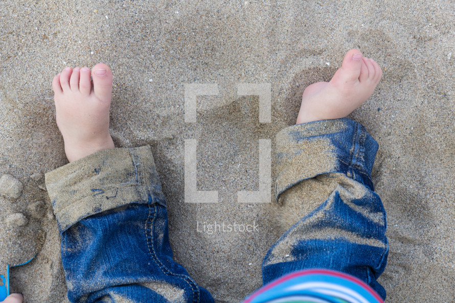 toddler's feet in the sand
