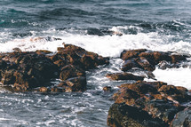 waves and rocks along a shore 