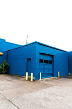 blue brick building and garage door 