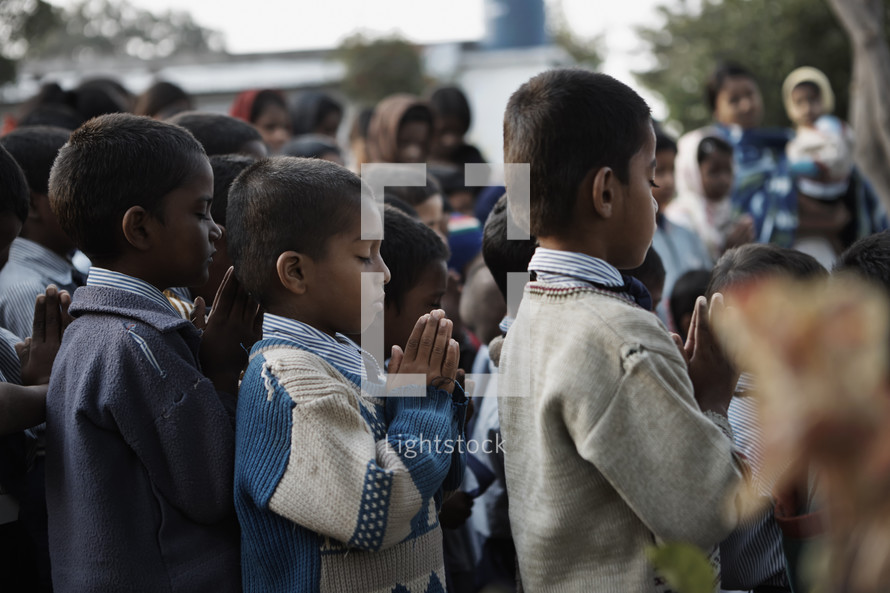 Children praying in central India