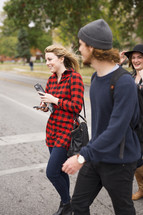 students walking to class on a college campus 