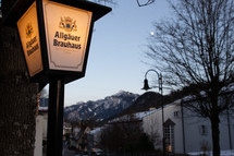 glowing street lamp and mountain view 