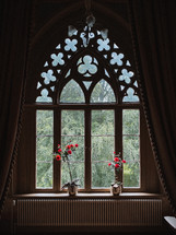 flower pots in an elegant window 