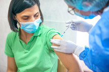 a woman receiving a vaccination 