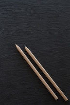 art pencils on a black background 