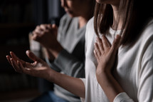 Women praying together