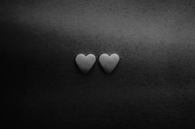 Minimal black texture background two hearts 