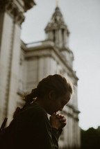 a young woman in prayer 