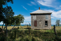 abandoned house along a shore 