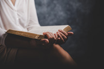 A woman holding her Bible. 