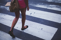woman crossing at a crosswalk 