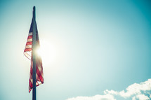 sunlight shining on an American flag 