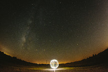 ball of light under a night sky 