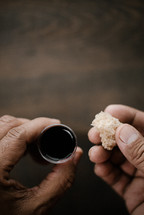 communion wine in a cup and bread 