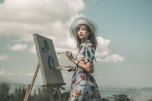 an artist painting on canvas 