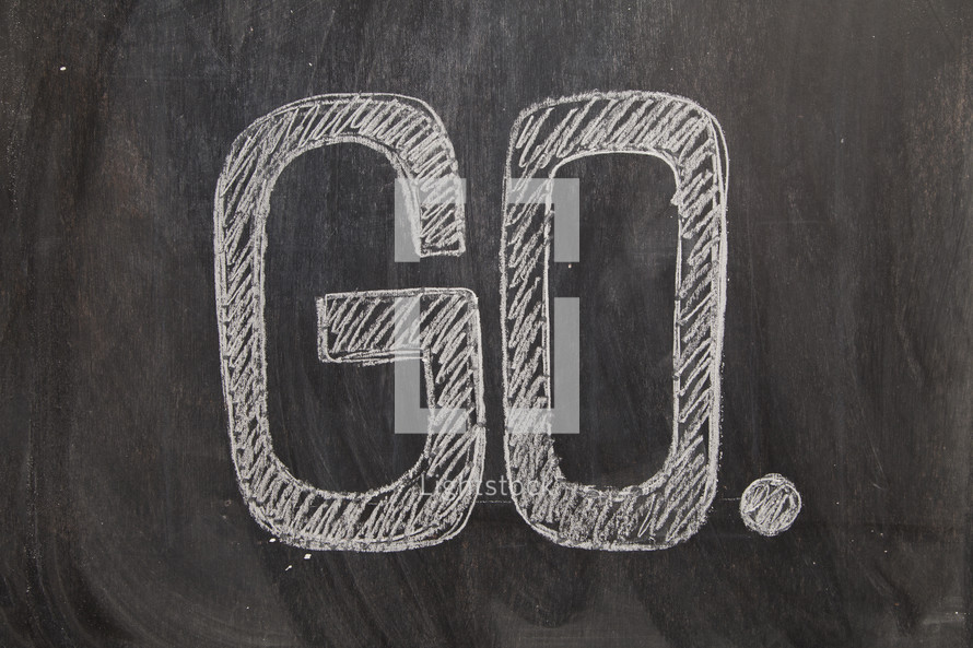 the word go written on a black chalkboard. missions concept. 