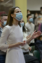 worshipers in face masks at a worship service 