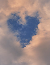 Dramatic Sky with Clouds and Heart Shape in the Middle