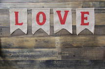 love banner against a wooden background 