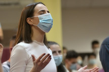 worshipers in face masks during a worship service 