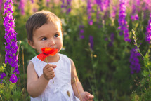 a child in a field of flowers 