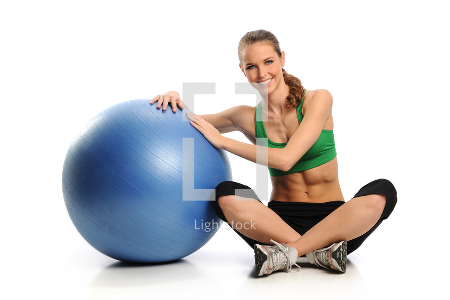 woman exercising with an exercise ball 