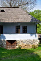 Old romanian traditional village wood and stone house