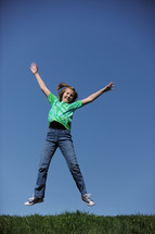 girl child jumping in the air 