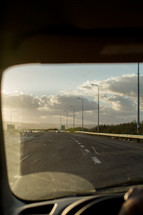view of the road ahead through a windshield 