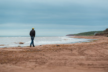 man walking on a beach 