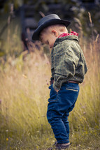 Little Cute Boy in Western Costume and Cowboy Hat