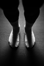 feet on a yoga mat 