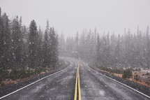 falling snow over a road 
