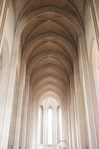 tall arched ceiling and windows in a cathedral 