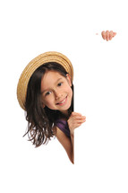 little girl in an Easter bonnet holding a sign 